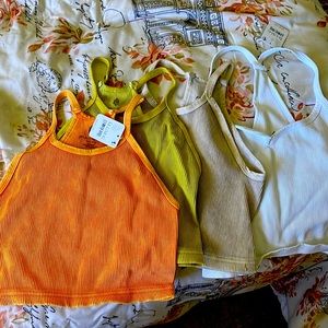 Free people***Movement crop tops orange yellow cream and white.